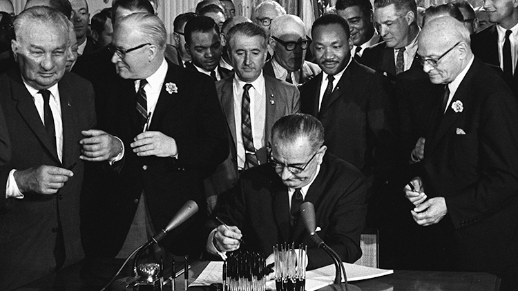 Johnson signs Civil Rights Act of 1964