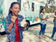 Girl eating ice cream from a truck
